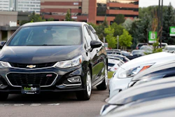 In this June 26, 2018, file photograph, a used 2017 Chevrolet Cruze sits in a row of other used, late-model sedans at a dealership in Centennial, Colo. Consumers bought an estimated 40.4 million used vehicles last year, likely passing the old record of 40.2 million set in 2018, according to figures from the Edmunds.com auto pricing site.