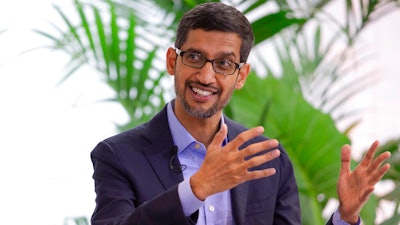 Google's chief executive Sundar Pichai addresses the audience during an event on artificial intelligence at the Square in Brussels, Monday, Jan. 20, 2020. Google's chief executive called Monday for a balanced approach to regulating artificial intelligence, telling a European audience that the technology brings benefits but also negative consequences.