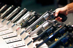 In this Jan. 19, 2016, file photo, handguns are displayed at the Smith & Wesson booth at the Shooting, Hunting and Outdoor Trade Show in Las Vegas. The gun industry is gathering for its annual conference, in January 2020, amid a host of uncertainty: slumping gun sales, a public increasingly agitating for restrictions on access to firearms and a presidential campaign that threatens gun rights like perhaps no other time in modern American history.
