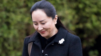 Meng Wanzhou, chief financial officer of Huawei, leaves her home in Vancouver, Monday, January, 20, 2020. A court hearing begins today in Vancouver over the American request to extradite an executive of the Chinese telecom giant Huawei on fraud charges.