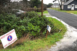 sign expressing opposition to a plan by Facebook to build a landing spot for a submarine cable connecting America with Asia stands on property in the tiny community of Tierra del Mar, Ore., Wednesday, Jan. 8, 2020.