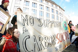 Activist of 'Extinction Rebellion' and 'Parents for Future Berlin' attend a protest rally against the climate policy of Australia's government in front of Australia's embassy in Berlin, Germany, Friday, Jan. 10, 2020.