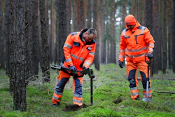 In this Wednesday, Jan. 8, 2020 photo members of a bomb disposal team search for WWII munition in Gruenheide near Berlin, Germany. Tesla CEO Elon Musk said during an awards ceremony in Berlin in November 2019 that 'we have decided to put the Tesla Gigafactory Europe in the Berlin area.' The company will also set up an engineering and design center in Berlin, Musk said. He wrote on Twitter that the new plant 'will build batteries, powertrains & vehicles, starting with Model Y.'