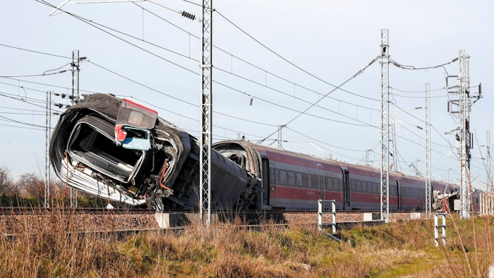 An overturned carriage of a high-speed train after the train derailed in the countryside near the town of Lodi, northern Italy, Thursday, Feb. 6, 2020. A high-speed passenger train derailed in northern Italy before dawn on Thursday on the heavily used Milan-Bologna line, with the motor car completely detaching, killing two railway workers and injuring 27 people, authorities said.