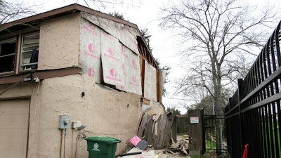In this Thursday, Jan. 30, 2020, photo, a Houston home remains in disrepair after being damaged by the Jan. 24, 2020, explosion at a nearby industrial business.