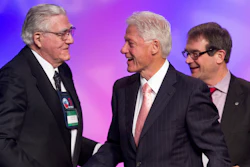 In this March 1, 2012 file photo, former President Bill Clinton shakes hands with Owen Bieber, left, with United Auto Workers union (UAW), at the 2012 UAW National Community†Action Program Conference, at the Marriott Wardman Park Hotel, in Washington.