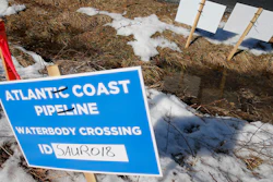 This Feb. 8, 2018, file photo shows signs that mark the route of the Atlantic Coast Pipeline in Deerfield, Va.