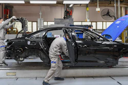In this Feb. 17 file photo released by Xinhua News Agency, workers assemble Audi A6 L cars at a workshop of FAW-Volkswagen Automobile Co., Ltd. in Changchun, northeast China's Jilin Province.