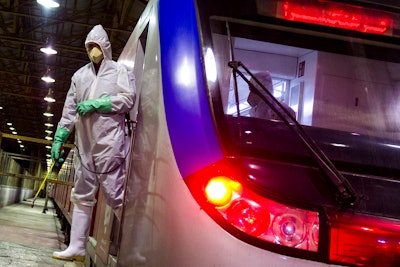Workers disinfect subway trains against coronavirus in Tehran, Iran, in the early morning of Tuesday, Feb. 25, 2020.