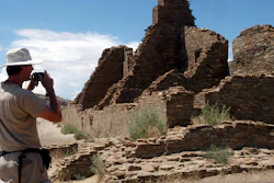 In this Aug. 10, 2005 file photo, tourist Chris Farthing from Suffolks County, England, takes a picture of Anasazi ruins in Chaco Culture National Historical Park in New Mexico.