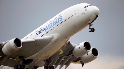 In this June 18, 2015, file photo, an Airbus A380 takes off for its demonstration flight at the Paris Air Show in Le Bourget airport, north of Paris. Commercial airliner maker Airbus is releasing 2019 earnings on Thursday, Feb. 12.