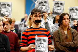 In this Jan. 8, 2019, file photo, protesters hold signs as they turn their backs on a meeting of the Virginia State Air Quality Control Board in Richmond, Va. The U.S. Supreme Court is set to wade into a long-running battle between developers of a 605-mile natural gas pipeline and environmental groups who oppose the pipeline crossing the storied Appalachian Trail. On Monday, Feb. 24, 2020, the high court will hear arguments on a critical permit needed by developers of the Atlantic Coast Pipeline.
