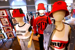 In this Feb. 20, 2020, photo, items from H&M’s new street wear collection are displayed at a store in New York. The collection was designed in collaboration with Ruth Carter, the Academy-Award winning designer behind the costumes for films such as “Black Panther” and “Malcolm X.' It debuted as more companies and brands are getting into the business of Black History Month but also trying not to leave the impression that African American consumers are important just once a year.