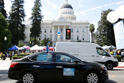 In this Aug. 28, 2019 file photo supporters of a measure to limit when companies can label workers as independent contractors circle the Capitol during a rally in Sacramento, Calif. U.S. District Judge Dolly Gee denied a request by ride-share company Uber and on-demand a request delivery service Postmates for a preliminary injunction protecting them from the new law aimed at giving protections to people who work as independent contractors, Monday, Feb.10, 2020.
