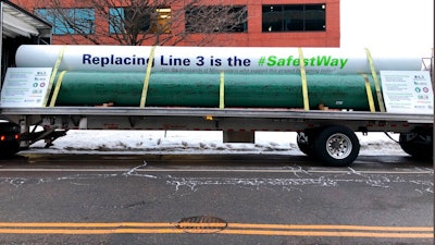 Supporters of Enbridge Energy's proposal to replace its aging Line 3 crude oil pipeline across northern Minnesota parked a truck near the State Capitol in St. Paul, Minn., on Friday, Jan. 31, 2020, carrying pipeline segments signed by people who back the project. They contend that replacing the aging pipeline with new pipe will provide the safest way to carry Line 3's oil from Alberta to Enbridge's terminal in Superior, Wisconsin.