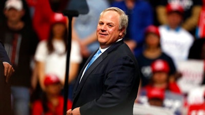 In this Feb. 20, 2020, file photo Interior Secretary David Bernhardt joins President Donald Trump as he speaks at a campaign rally in Colorado Springs, Colo. The Trump administration moved Thursday on a water-recycling push it says could get good use out of more of the wastewater that industries, cities and farms spew out, including the billions of barrels of watery waste generated by oil and gas fields each year.