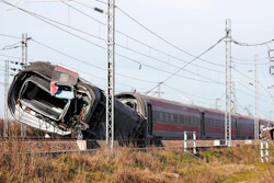 An overturned carriage of a high-speed train after the train derailed in the countryside near the town of Lodi, northern Italy, Thursday, Feb. 6, 2020. A high-speed passenger train derailed in northern Italy before dawn on Thursday on the heavily used Milan-Bologna line, with the motor car completely detaching, killing two railway workers and injuring 27 people, authorities said.