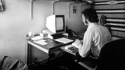 In this 1970s photo provided by Xerox PARC, Larry Tesler uses the Xerox Parc Alto early personal computer system.