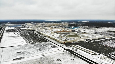 In this Nov. 28, 2018, file photo, snow covers the perimeter of the General Motors' Lordstown plant, in Lordstown, Ohio. The Trump administration’s budget proposal scraps a loan program that could help an upstart electric vehicle company’s plans to reuse the now-closed General Motors factory in Lordstown, Ohio.