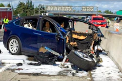 In this March 23, 2018, file photo provided by KTVU, emergency personnel work a the scene where a Tesla electric SUV crashed into a barrier on U.S. Highway 101 in Mountain View, Calif. The National Transportation Safety Board says the driver of a Tesla SUV who died in a Silicon Valley crash two years ago was playing a video game on his smartphone at the time. Chairman Robert Sumwalt said at the start of a hearing Tuesday, Feb. 25, 2020 that partially automated driving systems like Tesla's Autopilot cannot drive themselves. Yet he says drivers continue to use them without paying attention.