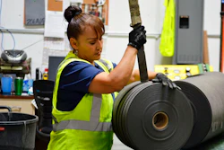 In this May 25, 2018 file photo, an employee at Acme Mills in Santa Teresa, N.M., works to organize textiles. Border trade leaders are expressing optimism for the 2020 trade forecast with Mexico, especially at the busy Santa Teresa Port of Entry in New Mexico, following the new free trade agreement.