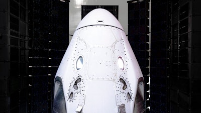 This undated photo made available by SpaceX in February 2020 shows the Crew Dragon spacecraft undergoing acoustic testing in Florida. On Tuesday, Feb. 18, 2020, SpaceX announced it is working with Space Adventures Inc. to take tourists into a high orbit. Ticket prices aren't being divulged but are likely to be in the millions of dollars.