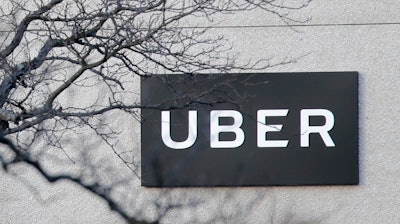 In this Nov. 15, 2019, file photo is an Uber office in Secaucus, N.J. Uber continued to lose cash as it poured money into building its food delivery business and developing technology for driverless cars, but revenue for its rides business nearly tripled as the company picked up more passengers around the world. The ride-hailing giant lost $1.1 billion in the fourth quarter of 2019, about 24% more than it lost at the same time last year.