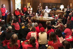 In this Nov. 21, 2019, file photo, demonstrators against a proposed liquid-natural gas pipeline and export terminal in Oregon sit in in the governor's office in the State Capitol in Salem, Ore., to demand Democratic Gov. Kate Brown stand against the proposal.