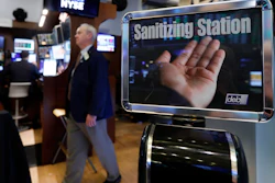 A trader passes a hand sanitizing station on the floor of the New York Stock Exchange on Tuesday, March 3. Federal Reserve Chairman Jerome Powell noted that the coronavirus 'poses evolving risks to economic activity.'