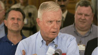 In this Sept. 18, 2004, file photo, U.S. Rep. Amory Houghton Jr., R-N.Y., speaks during a U.S. Congressional delegation visit in Baghdad, Iraq.