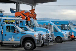 In this Jan. 14, 2019, file photo, Pacific Gas & Electric vehicles are parked at the PG&E Oakland Service Center in Oakland, Calif.