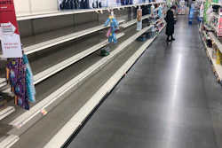 A shopper looks at items near empty shelves at a grocery store in Warrington, Pa., Tuesday, March 17, 2020. Coronavirus concerns have led to consumer panic buying of grocery staples.