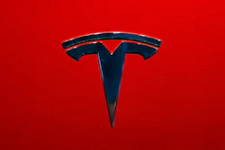 This Oct. 3, 2018, file photo shows the logo of Tesla Model 3 at the Auto show in Paris.