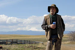 Cattle rancher Mike Filbin stands on his property in Dufur, Ore., after herding some cows and talks about the impact the new coronavirus is having on his rural community.