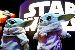 A pair of Baby Yoda dolls, by Mattel, are displayed at Toy Fair New York, in the Javits Convention Center, Monday, Feb. 24, 2020. From Baby Yoda to eco-friendly stacking rings, toymakers displayed an array of goods that they hope will be on kids' wish lists for the holiday 2020 season. The four-day Toy Fair comes as the U.S. toy industry has been whipsawed by a number of obstacles.