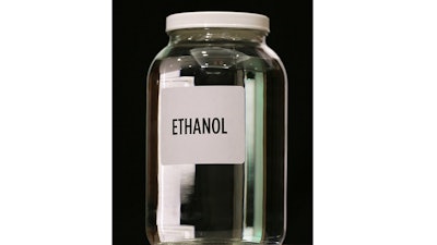 In this Jan. 28, 2014 file photo a jar of ethanol fuel sits on display during the Iowa Renewable Fuels Association meeting in Altoona, Iowa. As hospitals and nursing homes run out of hand sanitizer to fight off the coronavirus, struggling ethanol producers are eager to help. They could provide alcohol to make millions of gallons of the germ-killing sanitizer, but the U.S. Food and Drug Administration has put up a roadblock, frustrating both the health care and ethanol industries with its inflexible regulations during a national health care crisis.