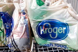In this June 15, 2017, file photo, bagged purchases from the Kroger grocery store in Flowood, Miss., sit inside this shopping cart. A group of Instacart workers are organizing a strike across the U.S. starting Monday, March 30, 2020, to demand more pay and protection as they struggle to meet a surge in demand for grocery deliveries during the coronavirus pandemic.