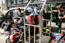Cailin Sandvig, left, and Justin Bracken, load their family car as they prepare to leave their home in the Crown Heights area of Brooklyn, in New York, with their newborn twins, Milo, center, and Aurelia, 10 months, to avoid the spread of the new coronavirus, Monday, March, 16, 2020. 'We are fleeing the city,' said Sandvig who works remotely for her job. 'We are going to end up in Wheaton, Illinois, where we have a big, old house to be in with my mom that's otherwise empty.'