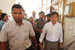 In the May 7, 2019, file photo, Myanmar national Shein Latt, left, and his boss U.S. national John Fredric Todoroki leave a local court after being arrested for operating a marijuana plantation in Ngazun Township, Mandalay region, central Myanmar. A Myanmar court on Tuesday sentenced Shein Latt to twenty years in prison under the country's drug laws concerning marijuana.