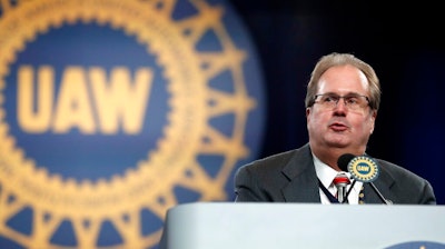 In this March 11, 2019 file photo, Gary Jones, president of the United Auto Workers union addresses delegates to the union's bargaining convention in Detroit. An expected guilty plea to corruption charges by former United Auto Workers President Gary Jones has been delayed due to the coronavirus and traveling concerns. Jones was to appear in federal court in Detroit on Thursday, March 12, 2020. He's accused of conspiring with UAW cronies to embezzle more than $1 million.