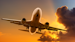 Jet Aeroplane Flying In Bright Sunset Sky Sun Rays 000009760454 Medium