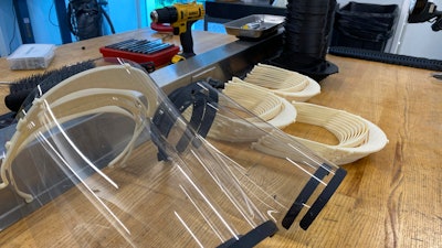 In this Friday, March 27, 2020, photo provided by NASCAR, safety splash shields are made at the NASCAR Research and Development Center in Concord, N.C.