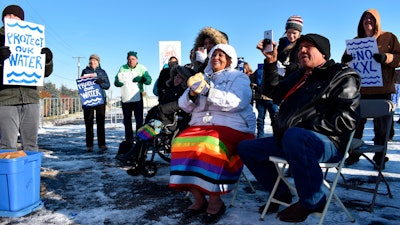 In this Oct. 29, 2019 file photo, opponents of the Keystone XL oil pipeline from Canada demonstrate in sub-freezing temperatures in Billings, Mont.