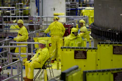 Workers gather near the Unit 2 reactor which is undergoing re-fueling during a tour of the Browns Ferry nuclear plant in Athens, Ala. U.S.