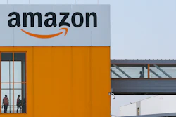 Employees observe social distancing due to coronavirus, at the entrance of Amazon, in Douai, northern France.