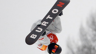 In this Feb. 14, 2018, file photo, Shaun White, of the United States, jumps during the men's halfpipe finals at the 2018 Winter Olympics in Pyeongchang, South Korea. The Burton snowboard company is donating 500,000 respirator masks to hospitals across the Northeast, harnessing the company's worldwide footprint to help put a dent in the country's lagging stockpile of personal protective equipment for the coronavirus pandemic.