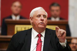In a Wednesday, Jan. 8, 2020 file photo, West Virginia Governor Jim Justice delivers his annual State of the State address in the House Chambers at the state capitol, in Charleston, W.Va. Gov. Justice said during a media briefing Wednesday, March 4, 2020, at the state Capitol in Charleston that state residents should live their normal lives and not cancel travel plans despite the emerging threat of the new coronavirus. There are no known cases of the virus thus far in West Virginia.