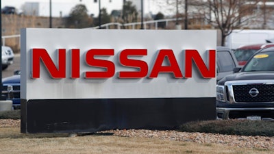 In this March 15, 2020, photograph, the company logo stands outside a Nissan dealership in Highlands Ranch, Colo.