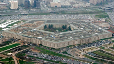This March 27, 2008, aerial file photo, shows the Pentagon in Washington. The Pentagon is reconsidering its awarding of a major cloud computing contract to Microsoft after rival tech giant Amazon protested what it called a flawed bidding process. U.S. government lawyers said in a court filing this week of March 13, 2020 that the Defense Department “wishes to reconsider its award decision” and take another look at how it evaluated technical aspects of the companies' proposals to run the $10 billion computing project. (AP Photo/Charles Dharapak, File)