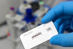 A scientist presents an antibody test for coronavirus in a laboratory of the Leibniz Institute of Photonic Technology (Leibniz IPHT) at the InfectoGnostics research campus in Jena, Germany, Friday, April 3, 2020.